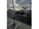 Exterior view from upper story features street, palm trees, and neighborhood at 2857 Queens Courtyard Dr, Las Vegas, NV 89109