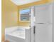 Modern bathroom with a combination bathtub and shower featuring a glass door and bright lighting at 3032 Hartley Cove Ave, North Las Vegas, NV 89081