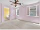 This bright bedroom has neutral paint, carpet floors, and a charming ceiling fan at 3032 Hartley Cove Ave, North Las Vegas, NV 89081