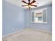 Bedroom featuring carpeted floors, a ceiling fan, and a window with shutters at 3032 Hartley Cove Ave, North Las Vegas, NV 89081