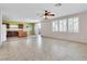 Bright living room features an open floor plan, neutral paint, and direct access to the backyard at 3032 Hartley Cove Ave, North Las Vegas, NV 89081