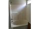 A tile trimmed bathtub with shower features in this bathroom at 3123 Inlet Bay Ave, North Las Vegas, NV 89031