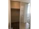Open closet with shelving and a mirrored sliding door at 3123 Inlet Bay Ave, North Las Vegas, NV 89031