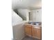 The kitchen area includes dual sinks, wooden cabinets, and a breakfast bar at 3123 Inlet Bay Ave, North Las Vegas, NV 89031