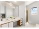 Bright bathroom features a soaking tub, shower, and vanity with ample natural light and a serene ambiance at 313 Firestone Dr, Las Vegas, NV 89145