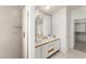 Well-lit bathroom featuring a shower, large mirror, and spacious countertops at 313 Firestone Dr, Las Vegas, NV 89145