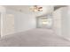 Spacious bedroom with plush carpet, large window, ceiling fan, and built in storage at 313 Firestone Dr, Las Vegas, NV 89145