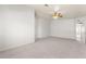 Bright bedroom with plush carpet, large window, ceiling fan, and built in storage at 313 Firestone Dr, Las Vegas, NV 89145