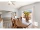 Dining area open to the living room with natural light and access to the backyard at 313 Firestone Dr, Las Vegas, NV 89145