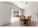 Cozy dining area featuring a sliding door to the backyard and neutral decor at 313 Firestone Dr, Las Vegas, NV 89145