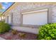 Close-up of a home exterior showing shuttered windows and mature landscaping at 313 Firestone Dr, Las Vegas, NV 89145