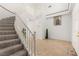 Bright foyer with grand staircase, neutral tile flooring, and soaring ceilings for an open, inviting entrance at 313 Firestone Dr, Las Vegas, NV 89145
