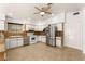 Eat in kitchen features tile floors, white cabinets and stainless steel appliances at 313 Firestone Dr, Las Vegas, NV 89145
