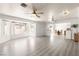 Bright and open living room features hardwood flooring and large windows at 313 Firestone Dr, Las Vegas, NV 89145