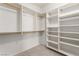 Spacious walk-in closet with custom built-in shelving and chrome hanging bars at 313 Firestone Dr, Las Vegas, NV 89145