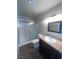 Bathroom with dark cabinets and tiled floors at 3151 Soaring Gulls Dr # 1092, Las Vegas, NV 89128