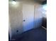 Exterior door of home with concrete siding and a light fixture above the door at 3151 Soaring Gulls Dr # 1092, Las Vegas, NV 89128