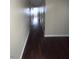 Hallway with hardwood floors and neutral colored walls at 3151 Soaring Gulls Dr # 1092, Las Vegas, NV 89128