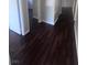 View of hallway with dark wood floors at 3151 Soaring Gulls Dr # 1092, Las Vegas, NV 89128