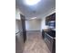 Kitchen with stainless steel appliances and view to dining room at 3151 Soaring Gulls Dr # 1092, Las Vegas, NV 89128