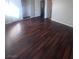 Main bedroom with hardwood floors and access to bathroom at 3151 Soaring Gulls Dr # 1092, Las Vegas, NV 89128