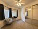Comfortable bedroom featuring a mirrored closet, window, and stylish decor at 3263 Quail Song Dr, Laughlin, NV 89029
