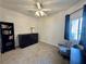 Cozy bedroom featuring a comfortable seating area and a window with natural light at 3263 Quail Song Dr, Laughlin, NV 89029