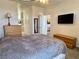 Comfortable bedroom with access to bathroom, closets, and well-lit kitchen at 3263 Quail Song Dr, Laughlin, NV 89029