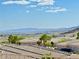 Scenic rooftop view overlooking palm trees and distant mountains at 3263 Quail Song Dr, Laughlin, NV 89029