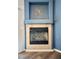 Close-up of a charming fireplace with tile surround, perfect for cozy evenings at 3263 Quail Song Dr, Laughlin, NV 89029