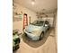 Attached garage with car, overhead storage, and a ladder at 3263 Quail Song Dr, Laughlin, NV 89029