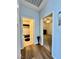 Bright hallway displaying a bathroom entrance and doorway leading to another room at 3263 Quail Song Dr, Laughlin, NV 89029