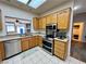 Bright kitchen showcasing stainless steel appliances and an open design concept at 3263 Quail Song Dr, Laughlin, NV 89029