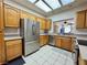 Bright kitchen featuring stainless steel refrigerator and ample counter space at 3263 Quail Song Dr, Laughlin, NV 89029