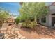 Serene backyard with comfortable seating, complemented by mature trees and well-kept landscaping at 3704 Blairmoor St, North Las Vegas, NV 89032