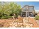 Spacious backyard featuring comfortable seating and views of the home's architecture at 3704 Blairmoor St, North Las Vegas, NV 89032