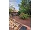Landscaped backyard with plants and stone walkways at 3704 Blairmoor St, North Las Vegas, NV 89032