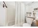 Bathroom featuring a shower-tub combo with white tile, a neutral vanity, and neutral color fixtures at 3704 Blairmoor St, North Las Vegas, NV 89032
