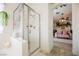 Shower and bathtub in primary bathroom at 3704 Blairmoor St, North Las Vegas, NV 89032