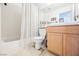Bathroom featuring a shower-tub combo with white tile, a neutral vanity, and neutral color fixtures at 3704 Blairmoor St, North Las Vegas, NV 89032