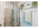 Bathroom showcasing a glass enclosed shower with decorative curtains and matching wall decor at 3704 Blairmoor St, North Las Vegas, NV 89032