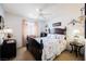 Cozy bedroom with a bed, side tables, and a ceiling fan at 3704 Blairmoor St, North Las Vegas, NV 89032