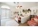 Spacious bedroom with a ceiling fan, private entrance, and lots of decorative accents at 3704 Blairmoor St, North Las Vegas, NV 89032