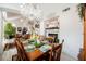 Spacious dining room with chandelier and seamless flow into other living areas at 3704 Blairmoor St, North Las Vegas, NV 89032