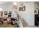 Bright foyer with staircase, carpeted steps, and views to the formal living room at 3704 Blairmoor St, North Las Vegas, NV 89032