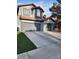 Inviting home with a two-car garage, complemented by a well-manicured lawn at 3704 Blairmoor St, North Las Vegas, NV 89032