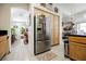 An open kitchen with stainless steel appliances and a view to the dining and living room at 3704 Blairmoor St, North Las Vegas, NV 89032