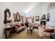 Cozy living room with high ceilings, floral furniture, and bright natural light at 3704 Blairmoor St, North Las Vegas, NV 89032