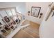 Carpeted staircase with white railings, leading to a beautifully decorated living area at 3704 Blairmoor St, North Las Vegas, NV 89032