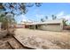 Spacious backyard featuring dirt, a patio, and an attached overhang for shade at 3751 Crellin Cir, Las Vegas, NV 89120